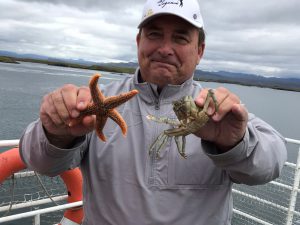 Holding Star Fish and Crab