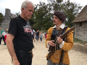 Man Demonstrating Old Flintlock Gun