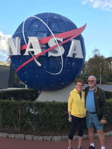 Couple standing in front of NASA sign